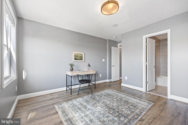 office area featuring baseboards and wood finished floors