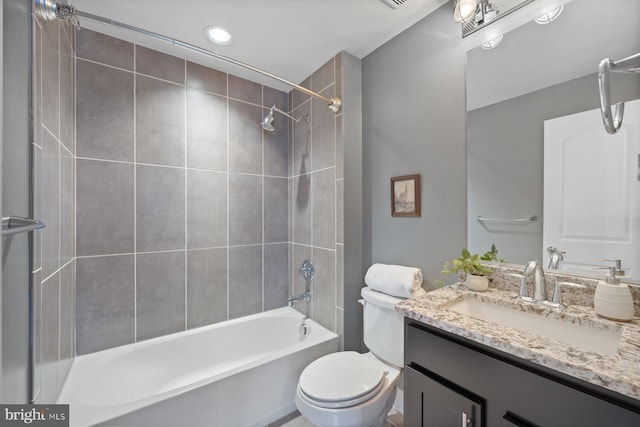 bathroom with toilet,  shower combination, and vanity