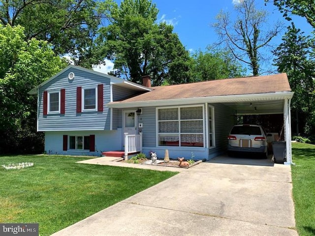 tri-level home with a front yard and a carport