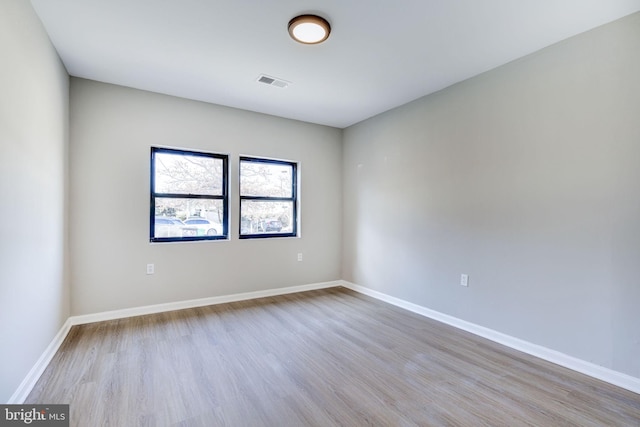 unfurnished room featuring light hardwood / wood-style floors