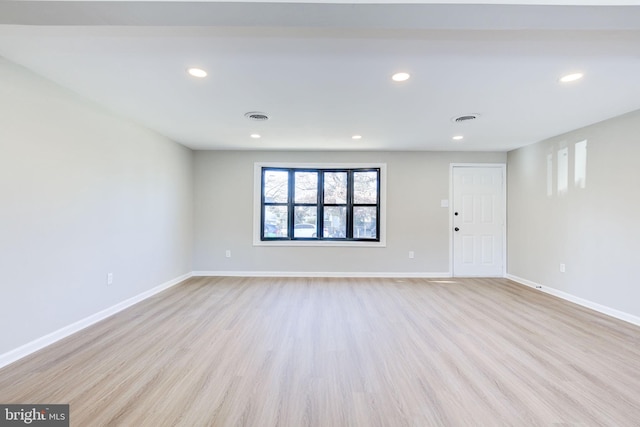 spare room featuring light hardwood / wood-style flooring