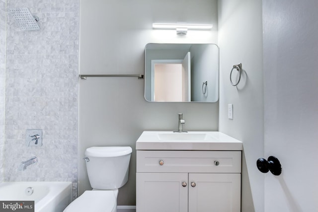 full bathroom featuring vanity, toilet, and tiled shower / bath combo