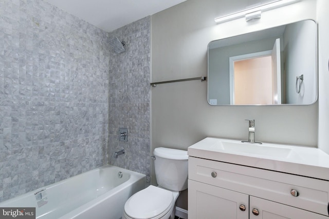 full bathroom with vanity, toilet, and tiled shower / bath combo