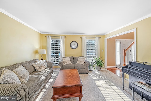 living room featuring crown molding and light carpet