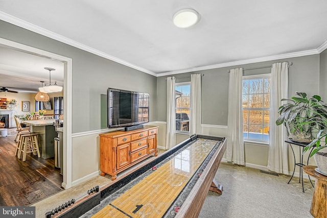 playroom with crown molding and dark hardwood / wood-style floors