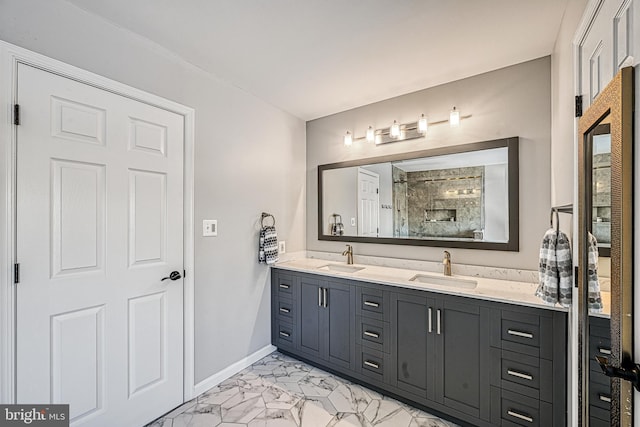 bathroom with vanity and a shower with shower door