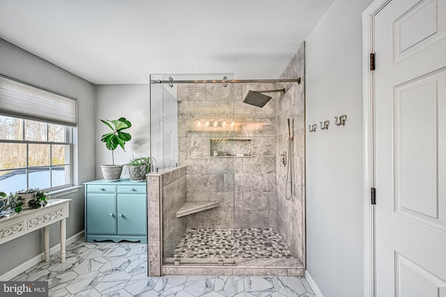 bathroom with a shower with door