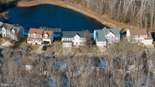 birds eye view of property with a water view