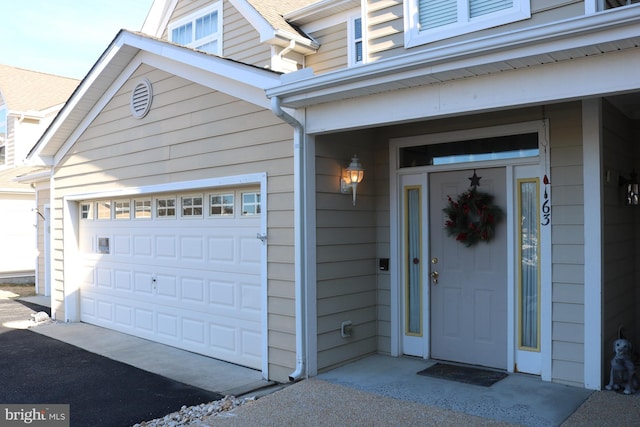 doorway to property featuring a garage