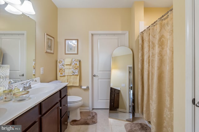 bathroom featuring tile patterned flooring and vanity