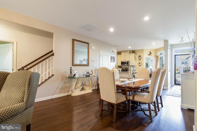 dining area featuring dark hardwood / wood-style flooring