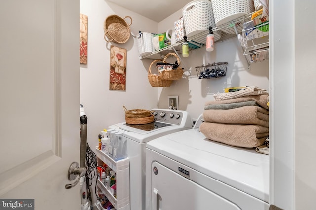 washroom with washing machine and clothes dryer