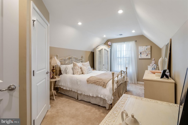 carpeted bedroom featuring vaulted ceiling