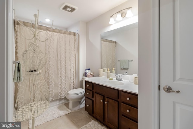 bathroom with tile patterned flooring, vanity, and curtained shower