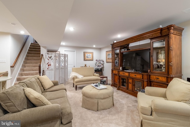 living room featuring light carpet