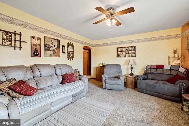 living room with carpet floors and ceiling fan