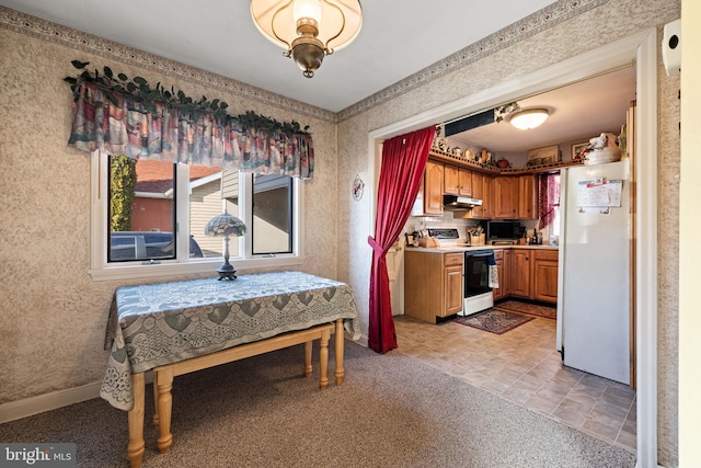 kitchen with light carpet and white appliances