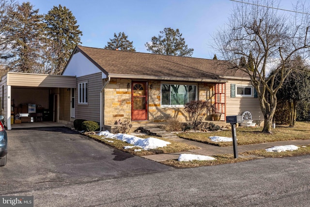 single story home featuring a carport