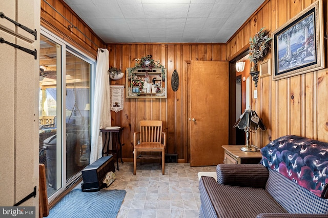 sitting room with wood walls