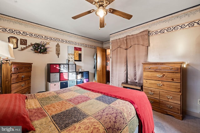 bedroom with crown molding, ceiling fan, and carpet