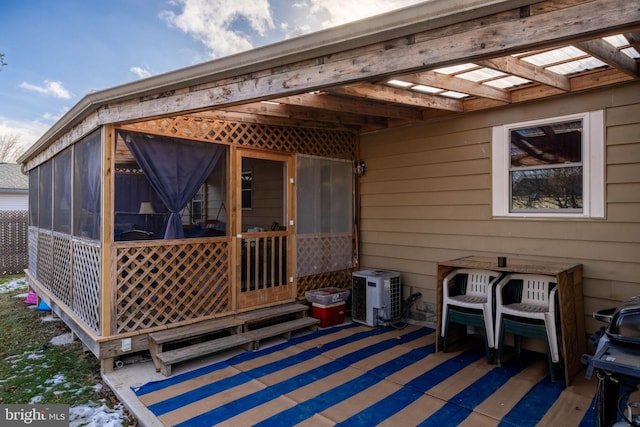 wooden terrace with a sunroom