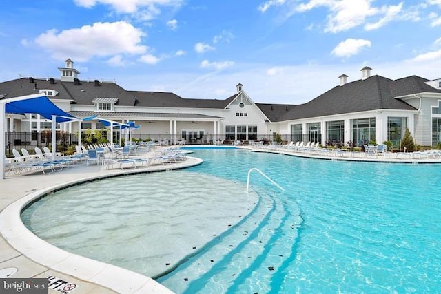 view of swimming pool featuring a patio area