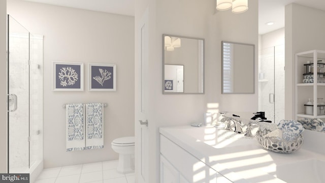 bathroom with tile patterned flooring, vanity, an enclosed shower, and toilet