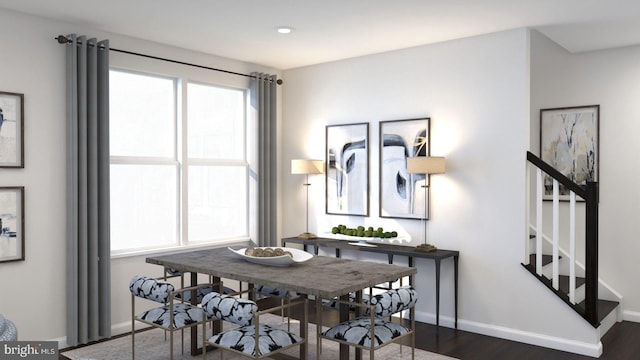 dining area featuring dark hardwood / wood-style floors