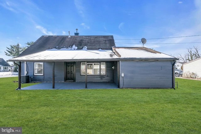 back of property with a yard, central AC unit, and a patio