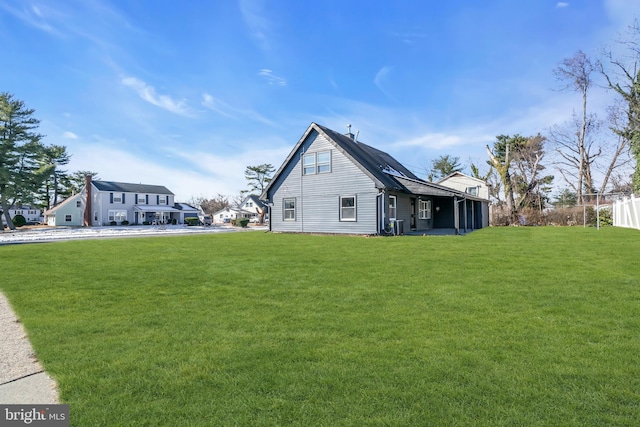 view of side of property with a yard