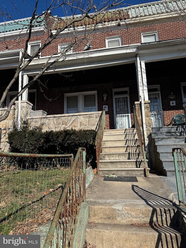 doorway to property featuring a porch