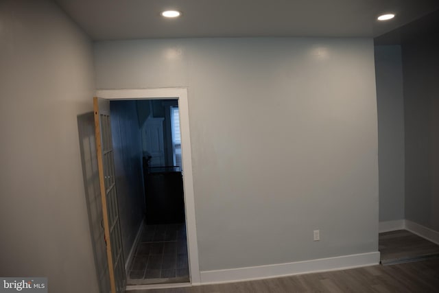 hallway with dark wood-type flooring