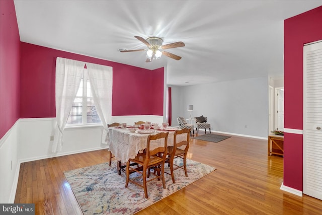 dining space with wood-type flooring