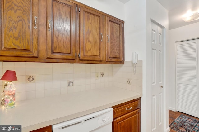 kitchen with decorative backsplash and dishwasher