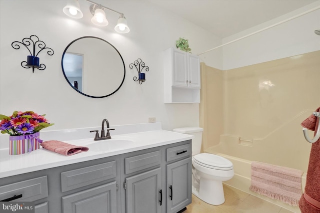 full bathroom featuring vanity, tile patterned floors, toilet, and bathtub / shower combination