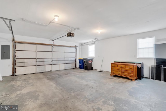 garage featuring a garage door opener and electric panel