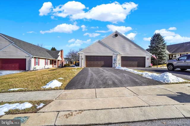 view of property exterior featuring a garage and a lawn