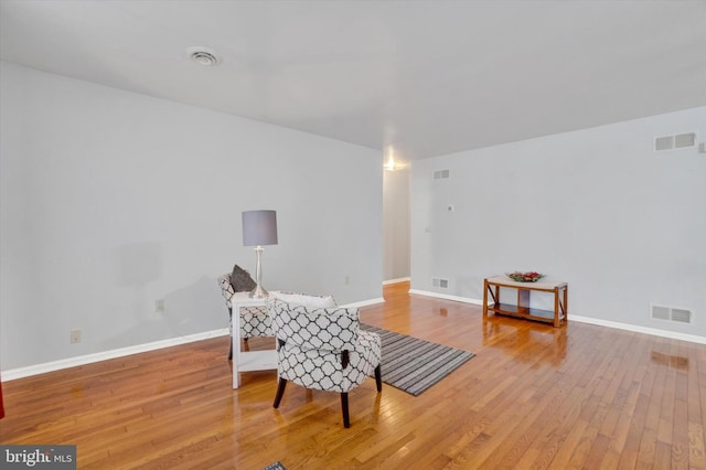 sitting room featuring light hardwood / wood-style flooring