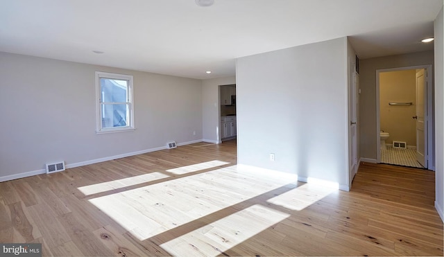 spare room with light wood-type flooring