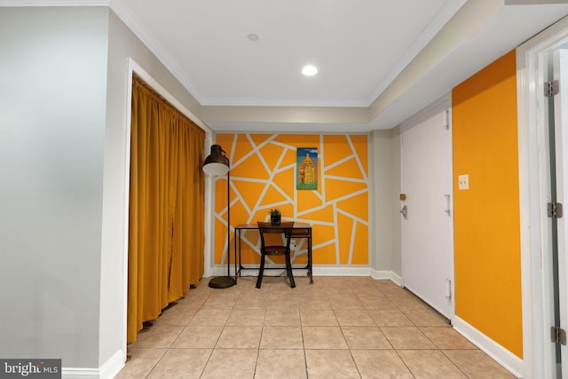 interior space featuring light tile patterned flooring and ornamental molding