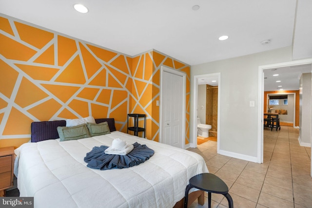 tiled bedroom featuring connected bathroom