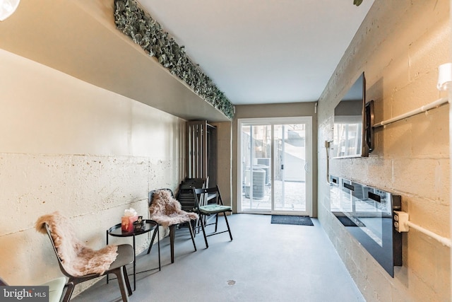 sitting room with concrete flooring