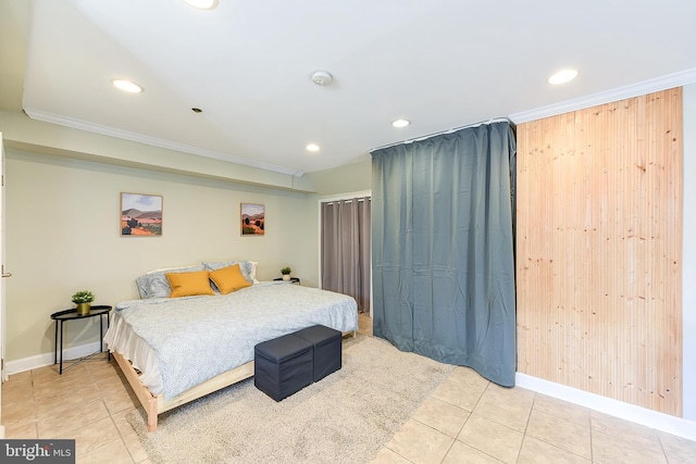 bedroom featuring tile patterned flooring, crown molding, and wood walls