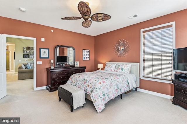 carpeted bedroom with ceiling fan