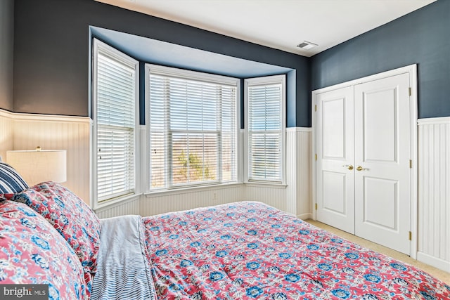 carpeted bedroom with a closet