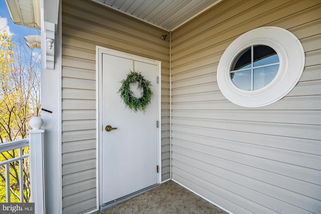 entrance to property with a balcony