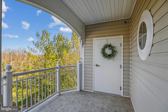 doorway to property featuring a balcony