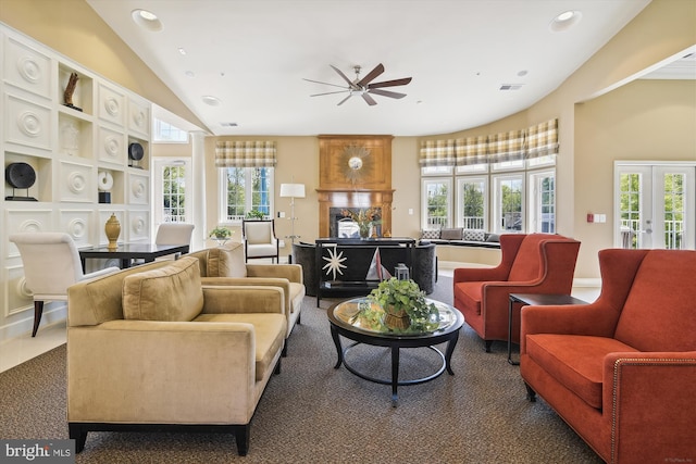 tiled living room with vaulted ceiling, french doors, and ceiling fan