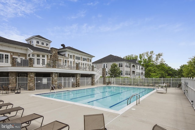 view of swimming pool with a patio