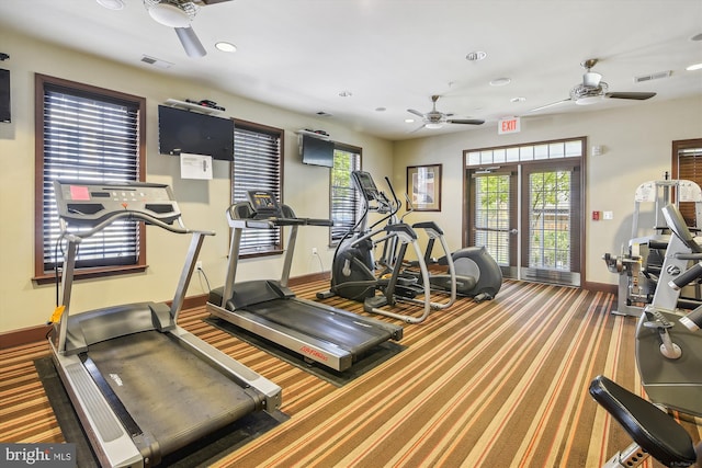 exercise room with ceiling fan and carpet flooring